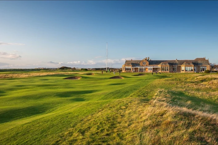 Royal Troon Old Course fairway and greens with the stone clubhouse behind