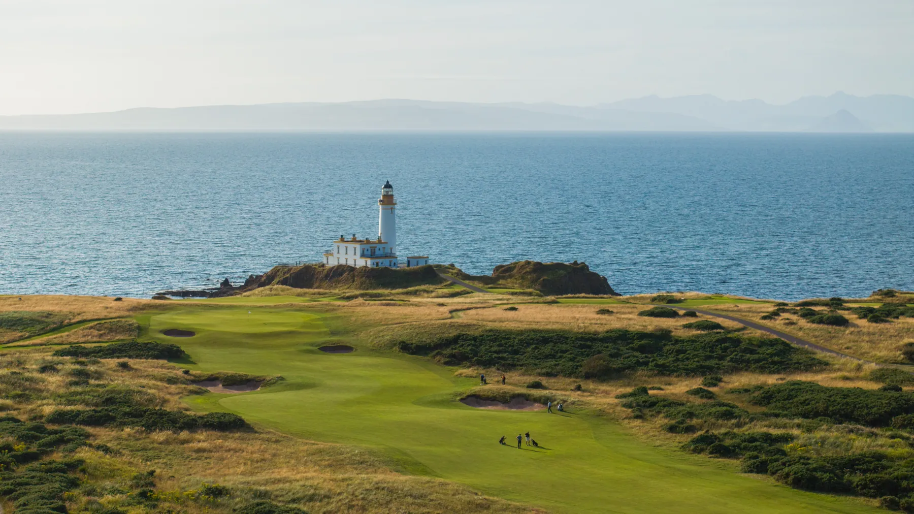 The Ailsa golf course at Trump Turnberry with the lighthouse and sea